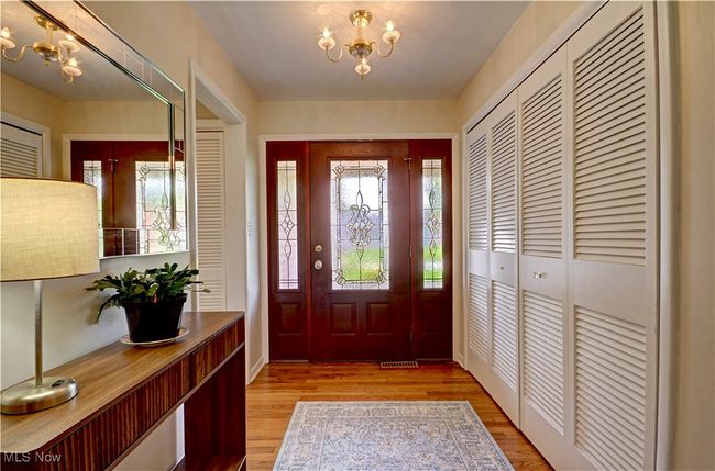 Entryway featuring a chandelier and light wood-style floors | Image 4