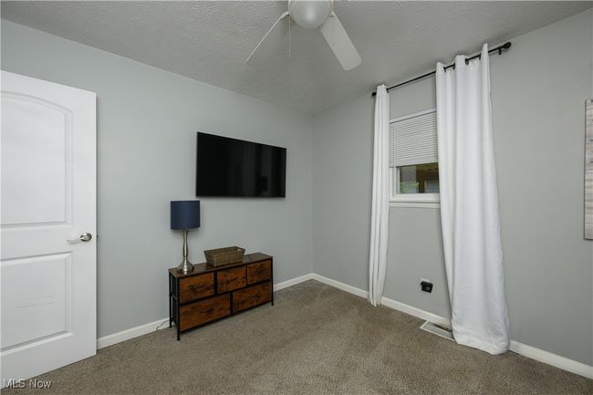 Bedroom featuring carpet and a ceiling fan | Image 12