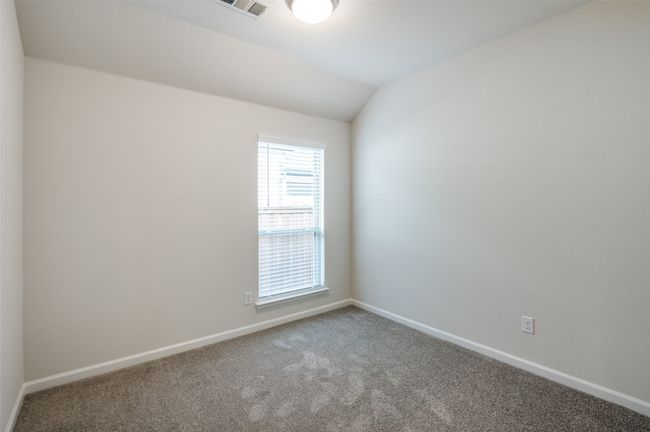 Unfurnished room with carpet and lofted ceiling | Image 21