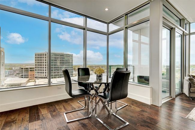 Dining room with a city / hill country view | Image 4