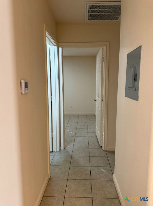 View of hallways, with great space throughout leading into the bedrooms. | Image 33
