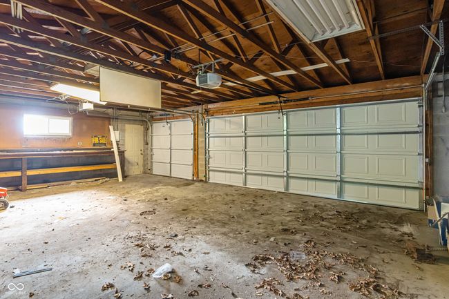 garage with a garage door opener | Image 49