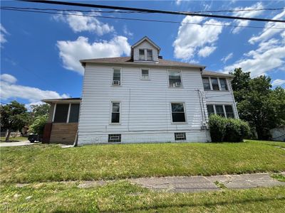 View of home's exterior with a yard | Image 3