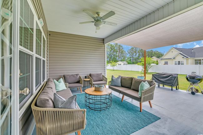 View of patio / terrace with grilling area, a fenced backyard, and an outdoor living space | Image 34
