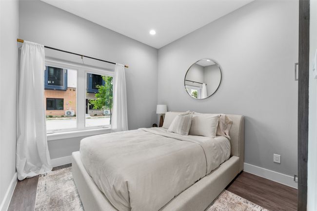 Bedroom with baseboards, recessed lighting, and wood finished floors | Image 12