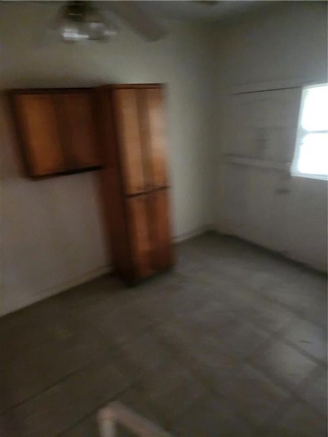 Unfurnished bedroom featuring tile patterned flooring | Image 8