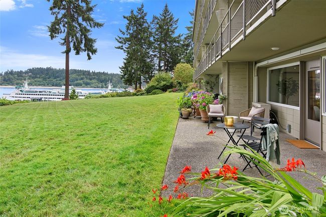View of patio area and spacious common lawn area | Image 26
