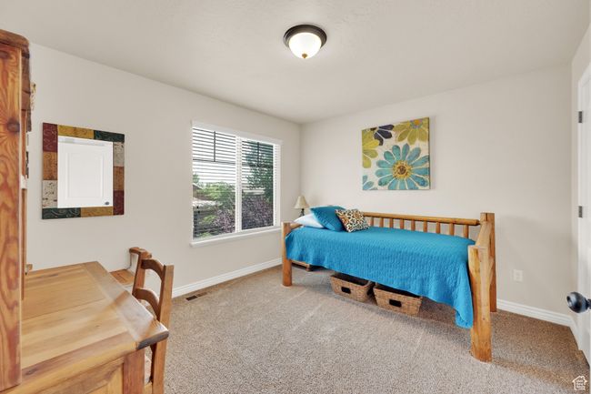 Bedroom with carpet flooring and baseboards | Image 17
