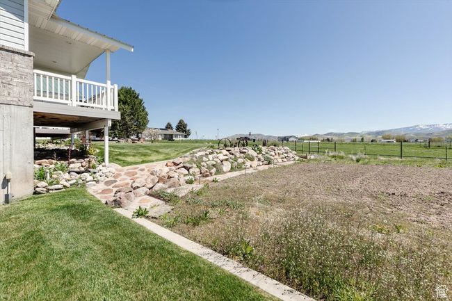View of grassy yard featuring a mountain view | Image 15