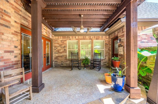 Enjoy seamless indoor-outdoor living with a spacious upper porch accessible from the living room and garage. Enhance pool safety with an optional mesh fence for added peace of mind. | Image 30