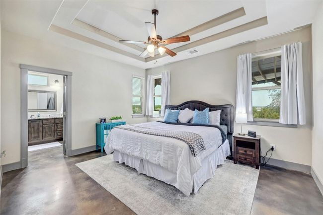 The primary bedroom is large and has gorgeous tray ceilings. | Image 17