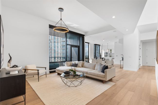 Living room featuring light wood-style floors, healthy amount of natural light, recessed lighting, and baseboards | Image 6