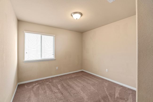 Empty room featuring baseboards and carpet flooring | Image 13