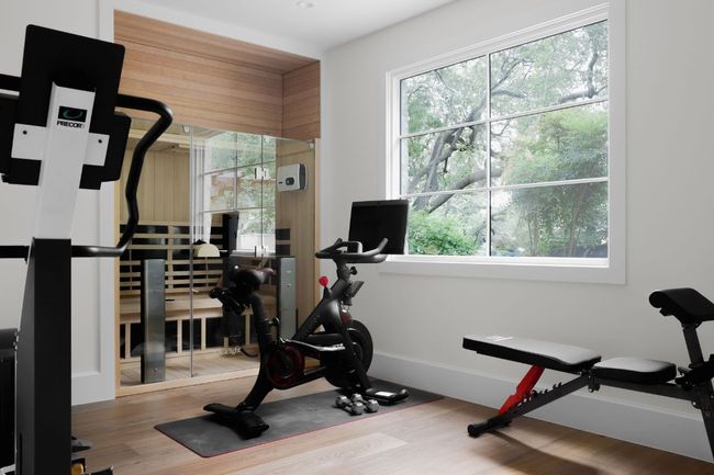 Exercise room featuring wood finished floors and baseboards | Image 22
