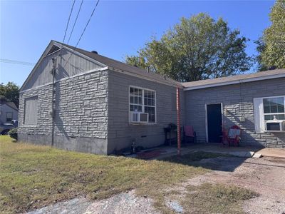 View of side of home with cooling unit and a yard | Image 3