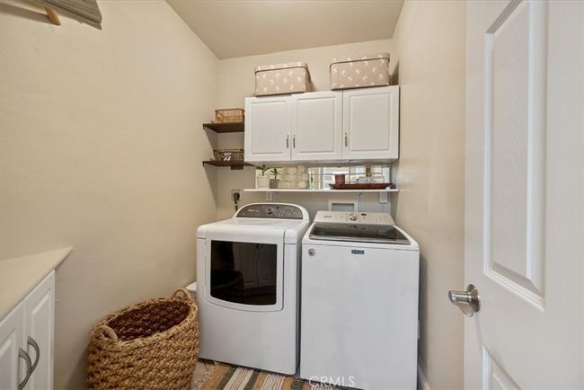 Large interior laundry room on first level, with lots of storage | Image 52
