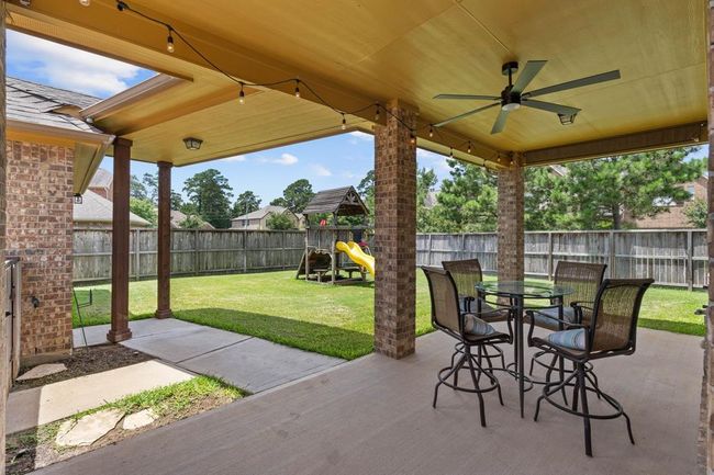 A beautiful covered patio to enjoy a morning cup of coffee. | Image 38