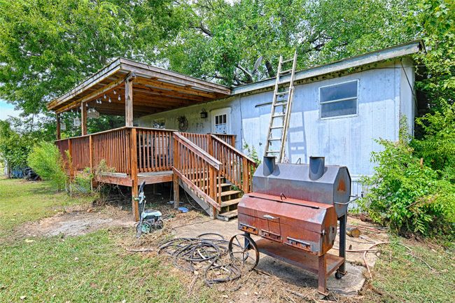 Rear view of house featuring a deck and stairway | Image 29