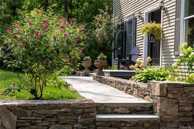 Stone wall and walkway to front door | Image 3