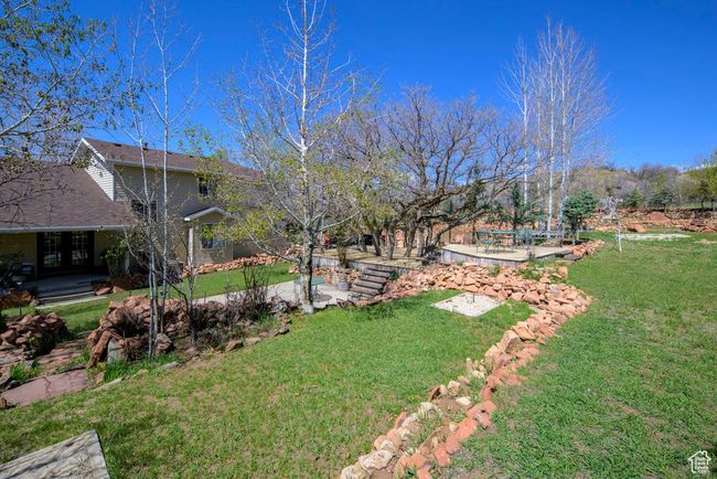 View of yard featuring a patio area | Image 68