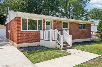 View of front of home with a garage and new concrete pavement | Image 2