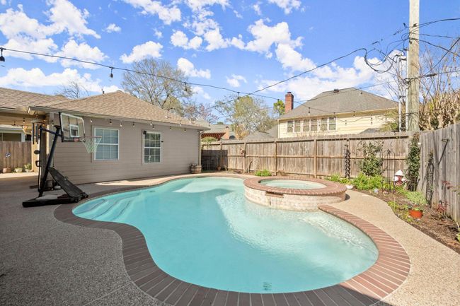 There is a small grassy area behind the garage for your pups to take care of business. Enjoy the Spring/summer bulbs and rose bushes that will color the backyard with happiness. | Image 36