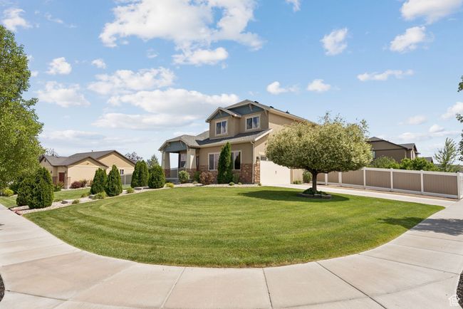 View of front of house featuring stucco siding and brick siding | Image 5