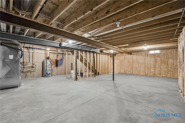 The spacious basement is framed and insulated, ready for final touches to use for additional living space. | Image 19