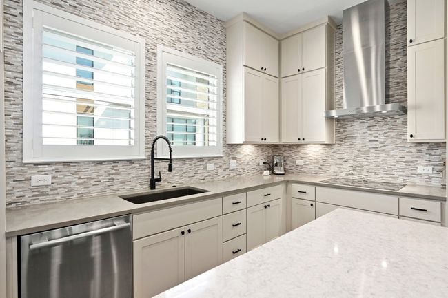 Backsplash extended to ceiling. | Image 5