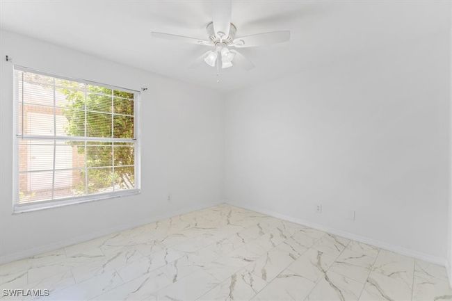 Unfurnished room with light tile patterned flooring and ceiling fan | Image 18