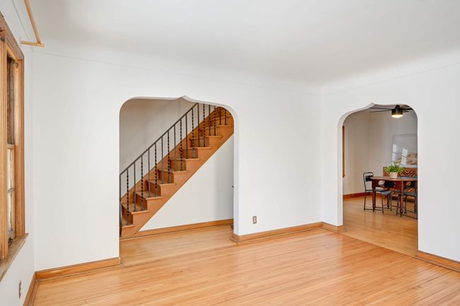 The sweet archways bookend the living room. | Image 6