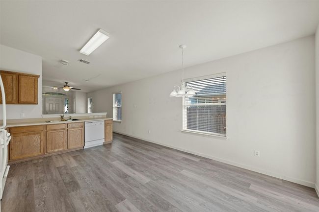 The open layout of the kitchen provides ample room for adding an island, whether fixed or freestanding, giving you the flexibility to create additional prep space and seating to suit your needs. | Image 14