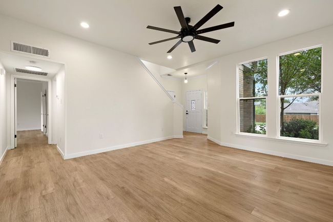 Living room and entry to the master suite that''s located downstairs | Image 4