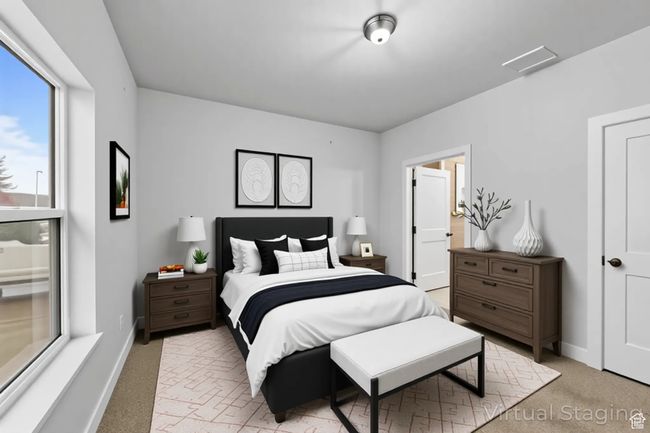 Bedroom featuring light carpet and baseboards | Image 28