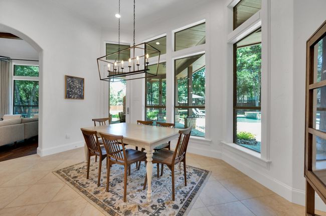 Enjoy the pool and backyard views with morning coffee | Image 17
