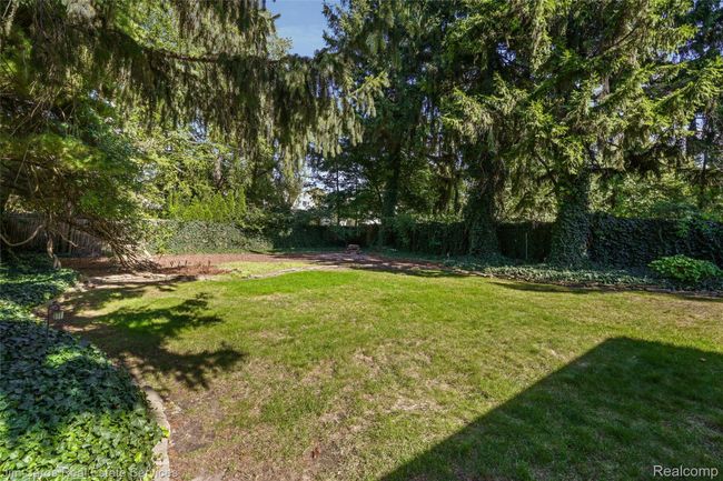 View of fenced backyard | Image 33