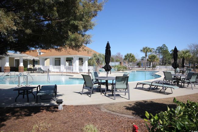 View of swimming pool featuring a patio area | Image 7