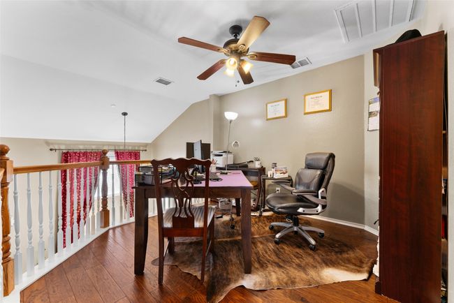 Office featuring hardwood / wood-style floors, visible vents, and a ceiling fan | Image 19