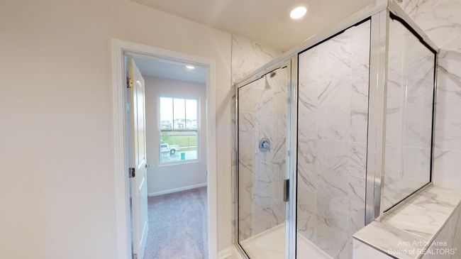 Upper level primary suite bathroom. | Image 19