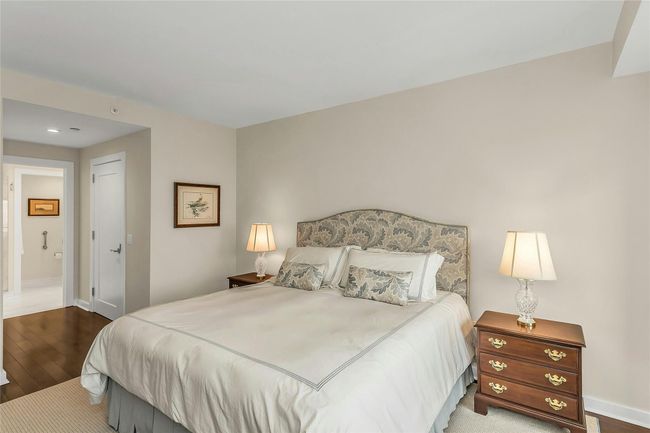 Bedroom with wood finished floors, baseboards, and recessed lighting | Image 12