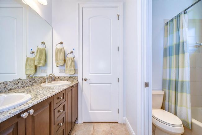 The tasteful tile accents and earthy tones make this space perfect for starting your day or unwinding at night | Image 24