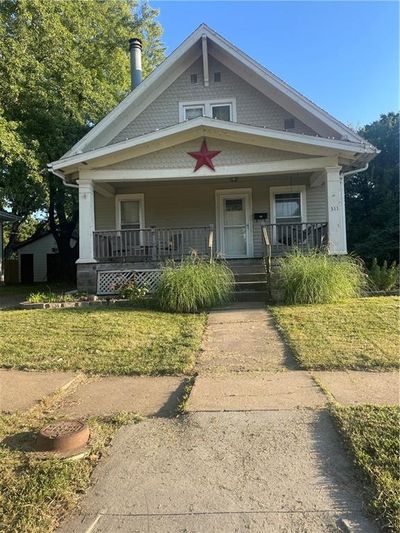 View of front of house featuring covered porch | Image 1