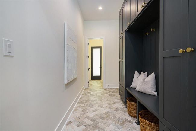 Mudroom leading to the garage and powder room, great flow | Image 14