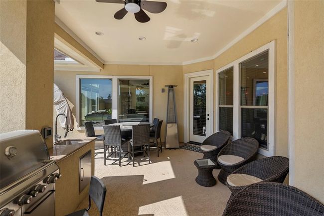 Let's have a look outside, ok? The door from the kitchen leads to this large covered patio | Image 24