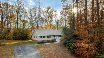 View of front of house with a porch and a front lawn | Image 1