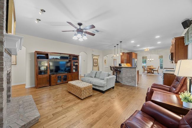 The current owners installed stunning wood floors in all of the living spaces and bedrooms (tile in the kitchen and bathrooms). | Image 6