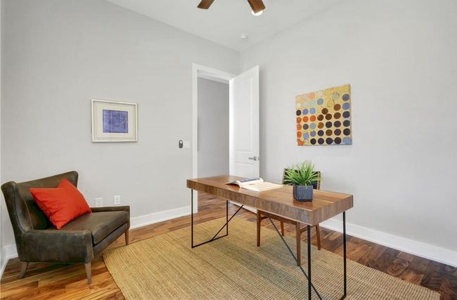 Office space featuring baseboards, ceiling fan, and wood finished floors | Image 21