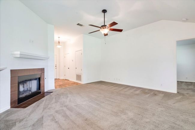 Living room featuring gas fireplace | Image 13