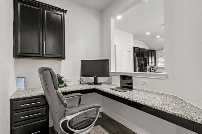 Office area featuring built in study area | Image 8