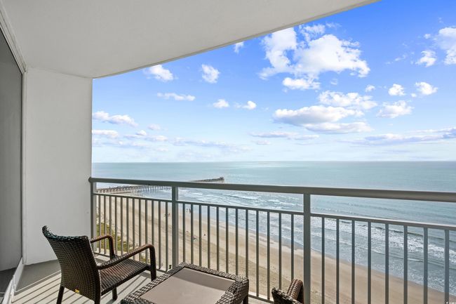 Balcony with a water view and a view of the beach | Image 40